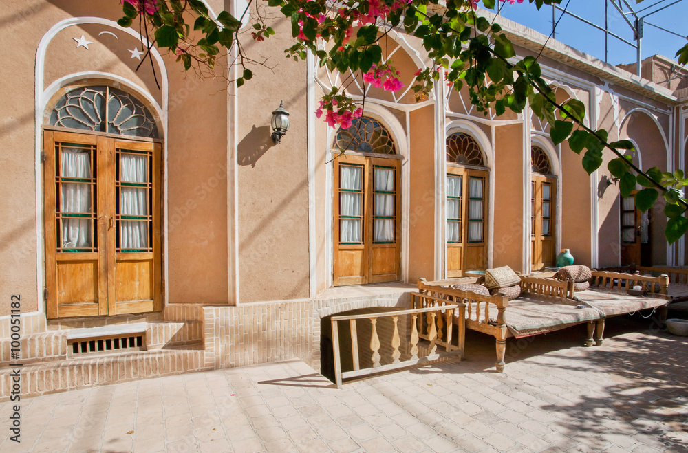 Courtyard of traditional privat iranian mansion with Ottoman couches for siesta