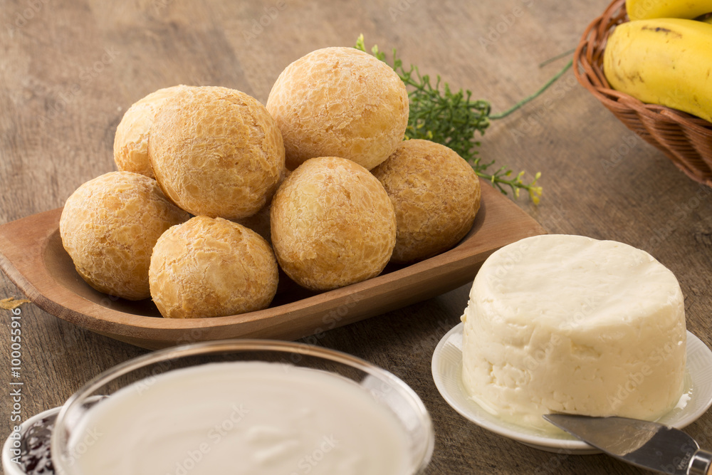 Brazilian cheese buns . Table cafe in the morning with cheese bread. Brazilian cheese buns . Table cafe in the morning with cheese bread.