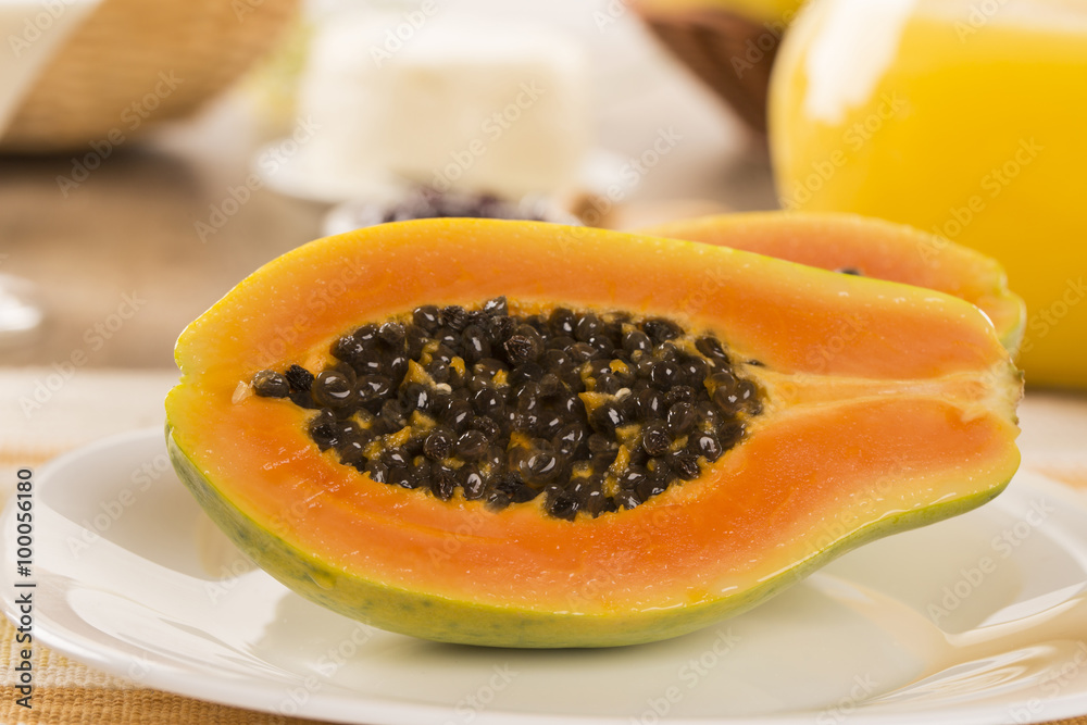 breakfast table with papaya and coffee breakfast table with papaya and coffee