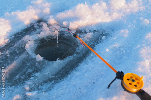 ice-hole and fishing tackle photo