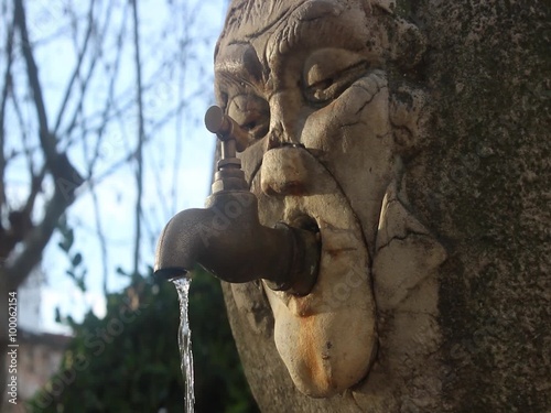 Old fountain with running water
