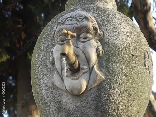 Old fountain with running water with sound
