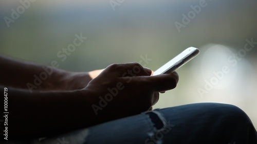 Male Model hands with cell phone photo