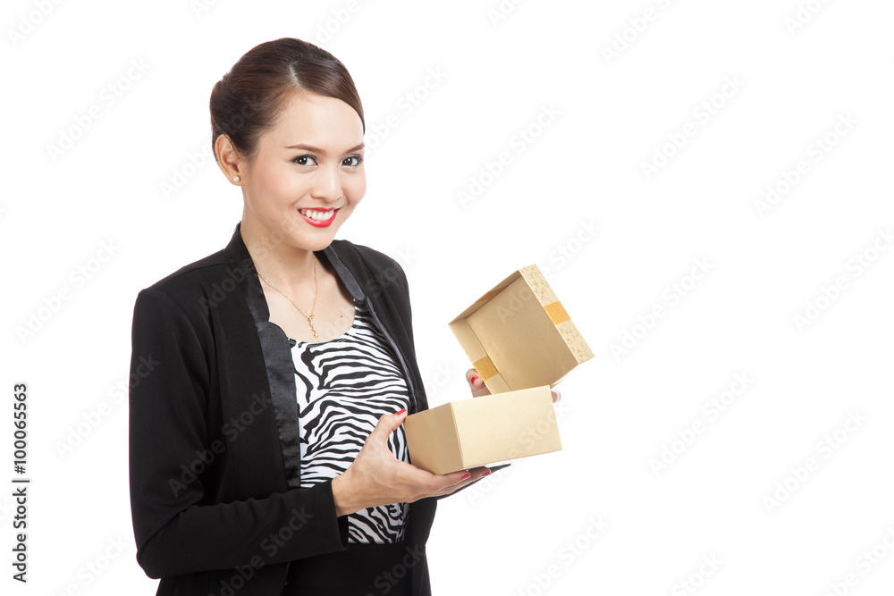 Young Asian business woman open a golden gift box Young Asian business woman open a golden gift box
