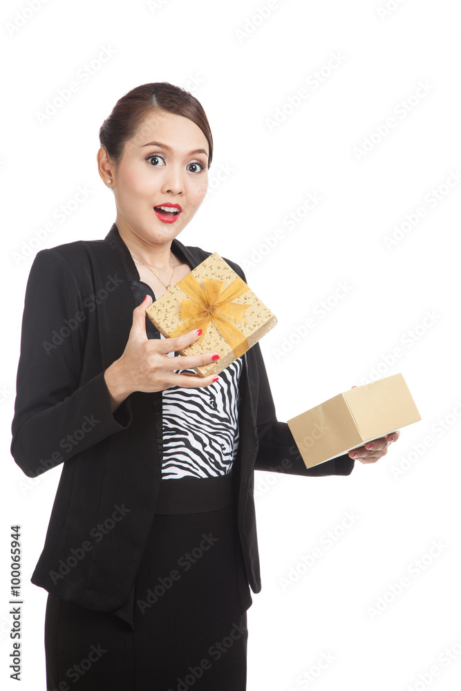 Surprised Asian business woman open a golden gift box Surprised Asian business woman open a golden gift box
