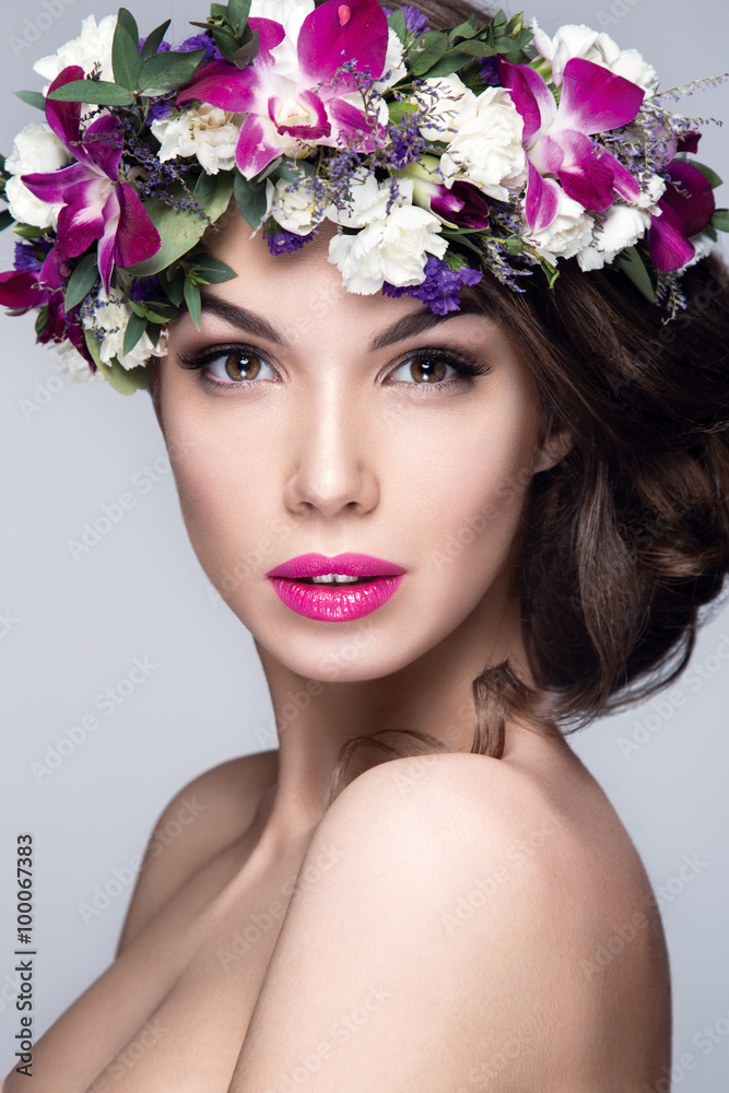 Beautiful woman portrait with flowers on head