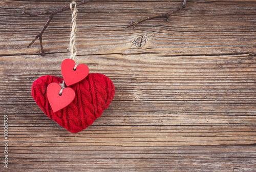 Valentines day red hearts over wooden background. Toned, soft focus, copy space 