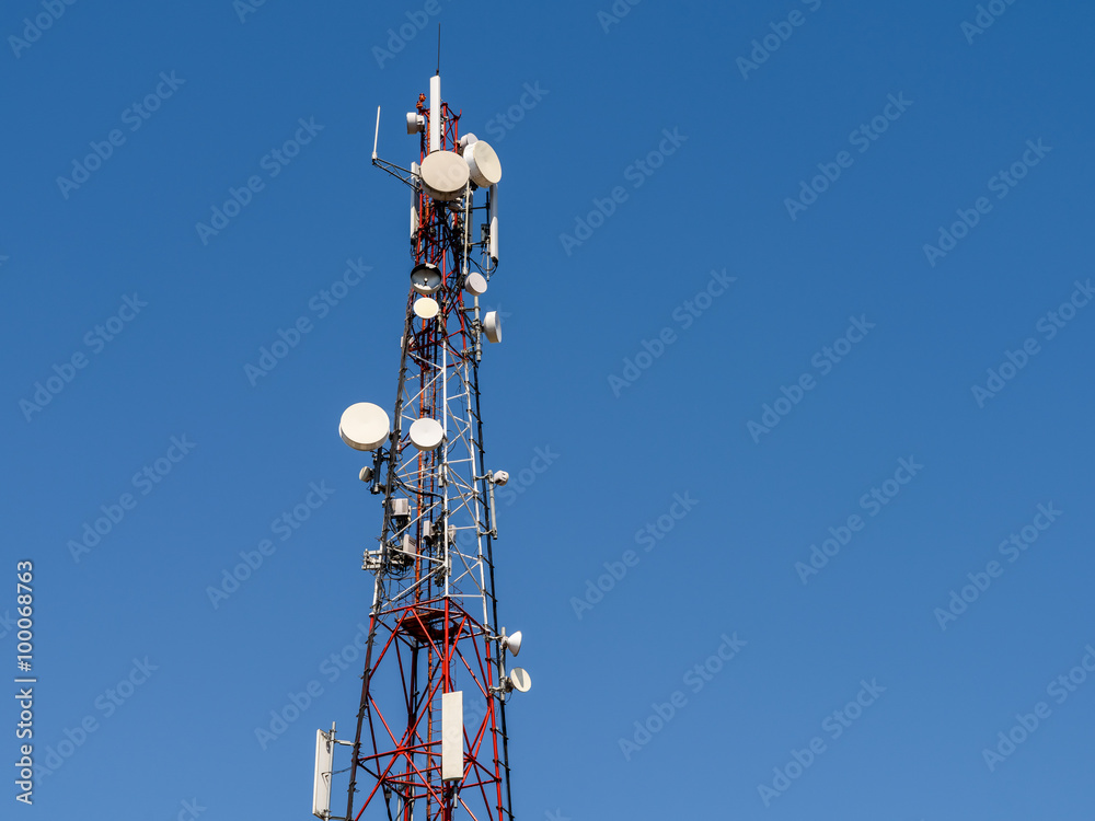 Broadcast Satellite Antenna Tower On Blue Sky