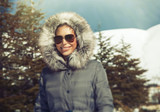 Beautiful woman in the winter mountains