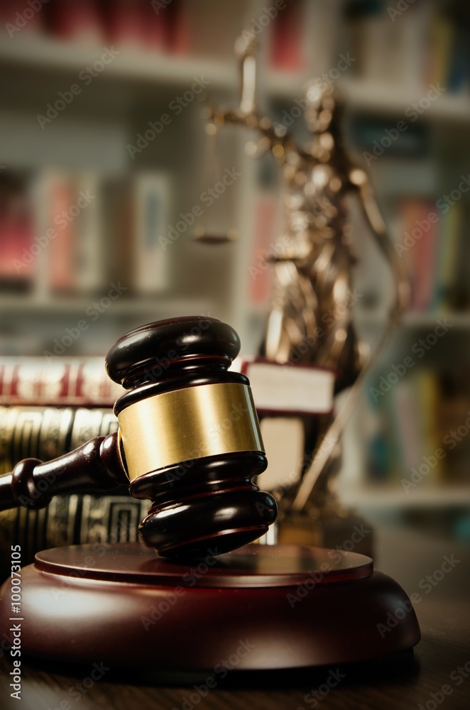 Law concept with gavel and Themis in background Law concept with gavel and Themis in background