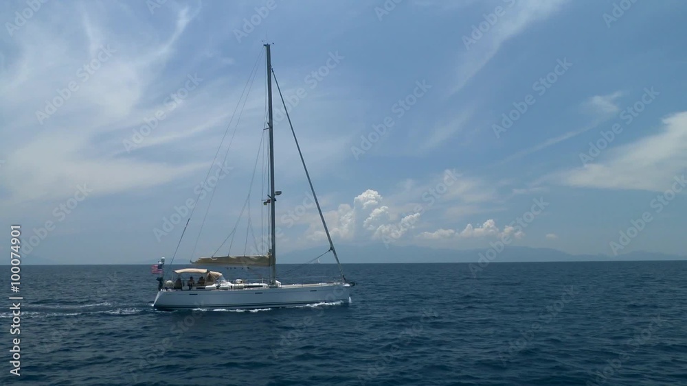 Sailing yacht floating on the background of distant mountainous coast.
Sailing yacht floating on the background of distant mountainous coast.