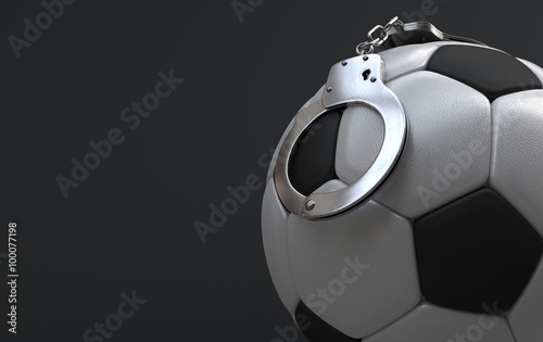 Soccer ball with handcuffs photo