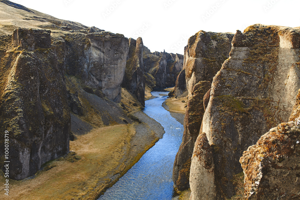 Deep Fjadrargljufur canyon landscape and river in Iceland.