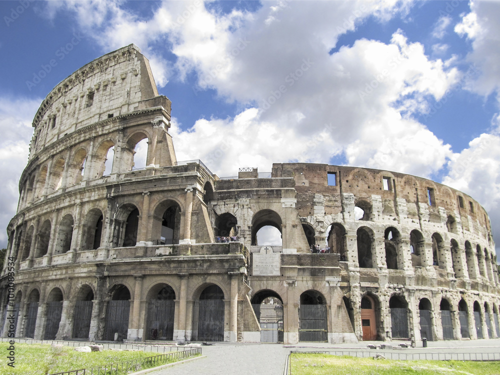 Colosseum in Rome with blue sky with clouds