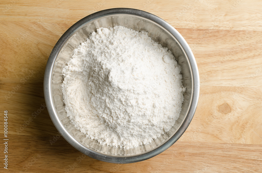 Flour in the bowl on wooden background,food ingredient Flour in the bowl on wooden background,food ingredient
