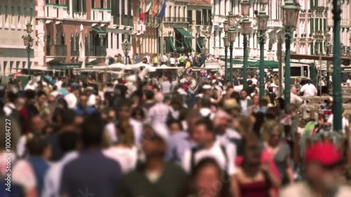 Tourists, heavy population walking traffic in a big city photo