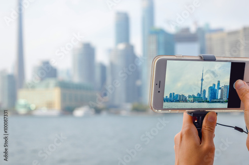 Photography Toronto downtown view through the mobile phone screen