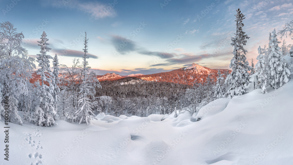 Obraz premium panorama winter mountains highlighted by rising sun