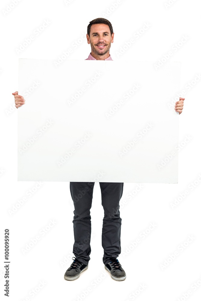 Smiling man holding white sheet Smiling man holding white sheet