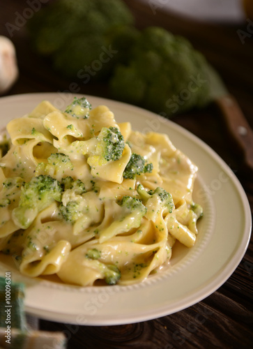 Pappardelle pasta with four cheese sauce and broccoli