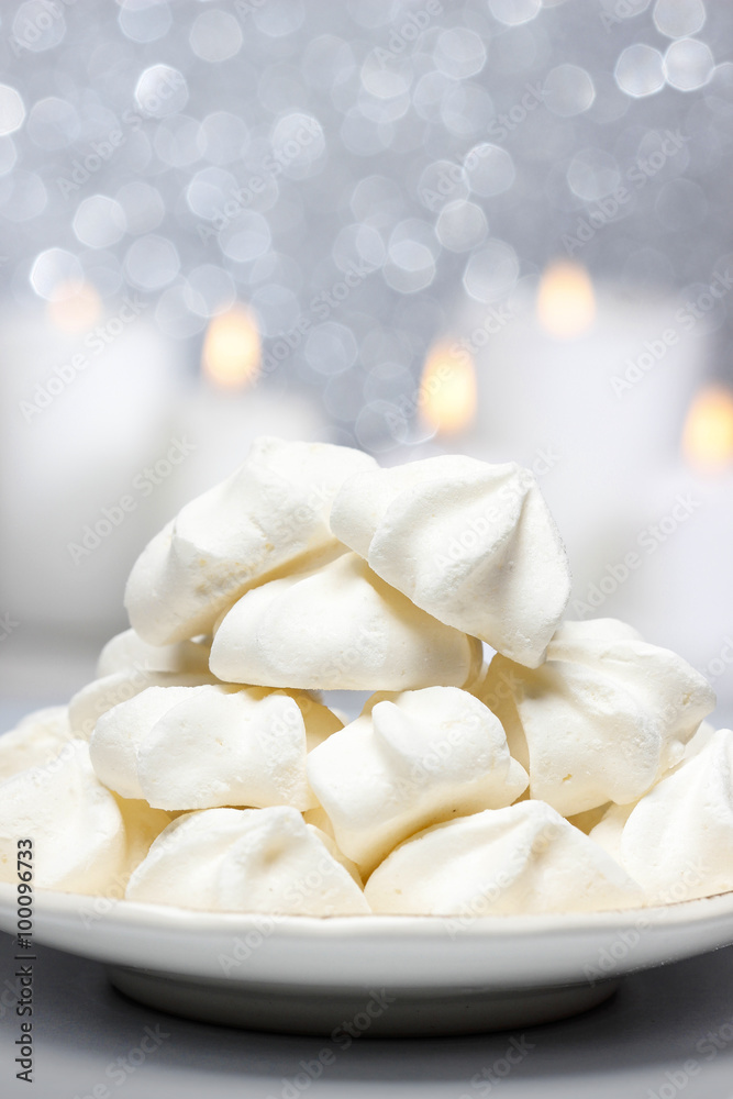 White meringues in christmas setting White meringues in christmas setting
