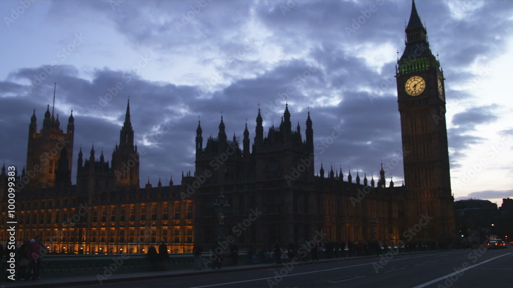 Shot of silhouetted Big Ben at dusk with passing traffic in London. Shot of silhouetted Big Ben at dusk with passing traffic in London.