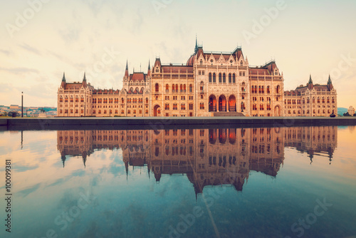 Parliament building in Budapest on a sunrise with reflection