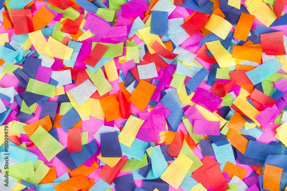Brightly colored paper confetti background featuring red, yellow