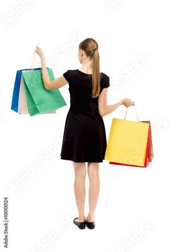 back view of woman with shopping bags .