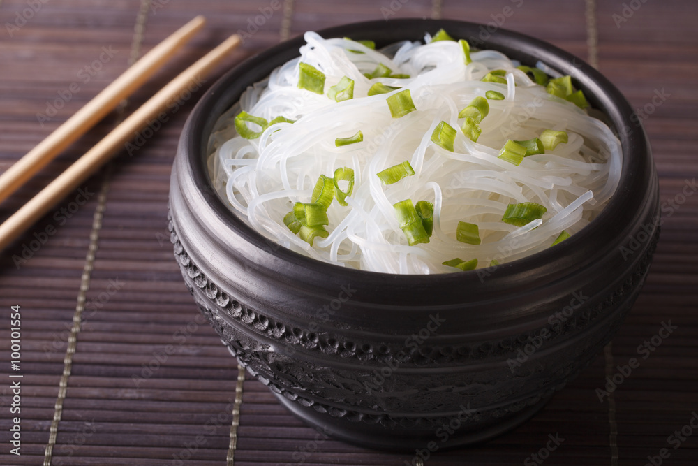 Chinese cellophane noodles close up in a bowl. horizontal
Chinese cellophane noodles close up in a bowl. horizontal