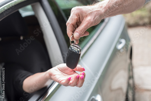 Woman getting his car keys
