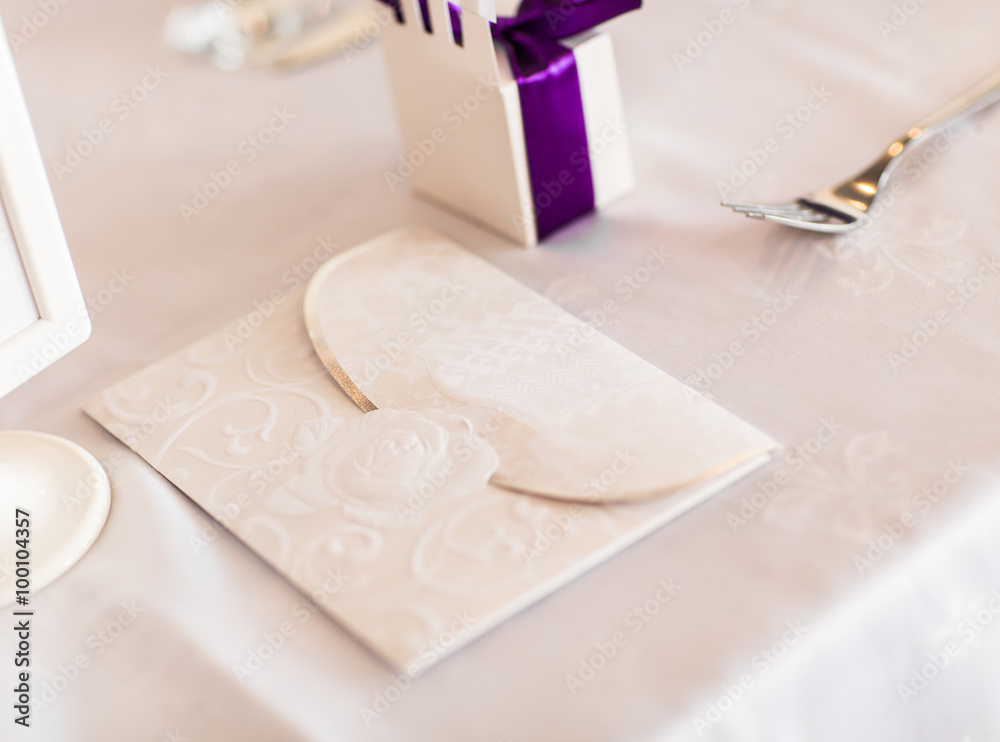 Paper wedding invitation on the table Paper wedding invitation on the table