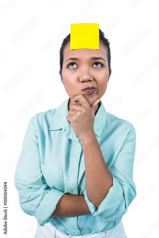 Businesswoman looking at the signe on her forehead Businesswoman looking at the signe on her forehead