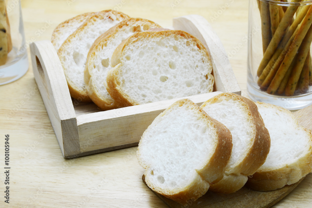 Naklejka premium bread stick on wood table