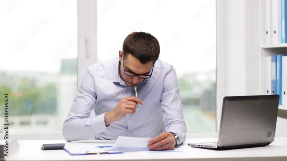 busy businessman with laptop and papers in office busy businessman with laptop and papers in office