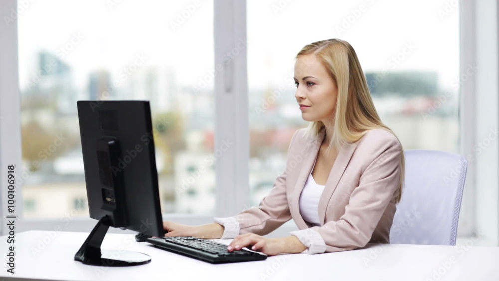 young businesswoman with computer typing at office young businesswoman with computer typing at office