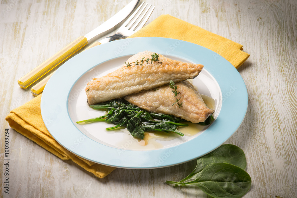 fish fillet with fresh spinach