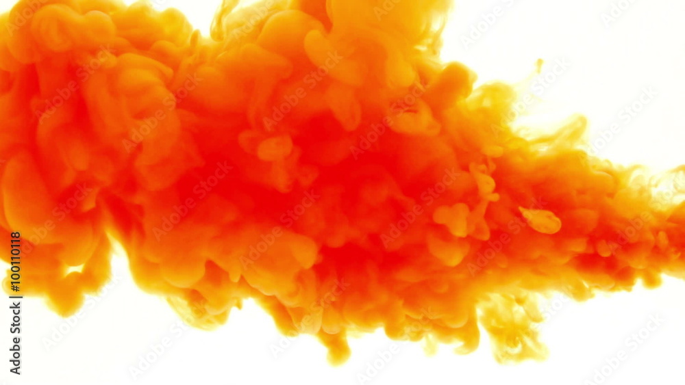 Orange ink in water.Creative slow motion. On a white background. 
