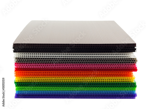 Stack of colorful  corrugated plastic sheets