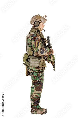 Ranger standing in woodland camouflage and modern machine gun. I