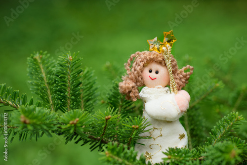 Christmas decoration angel sitting on the tree