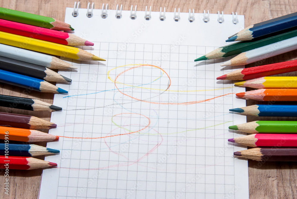 Obraz premium Colored pencils and paper