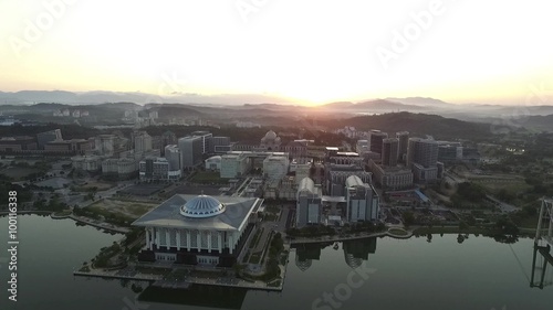 Aerial footage of Sultan Zainal Abidin Mosque also known as the Iron Mosque or Masjid Besi, and the Palace of Justice, Court of Malaysia taken during beautiful sunrise photo