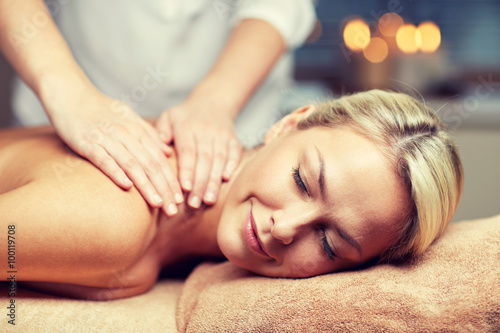 close up of woman lying and having massage in spa