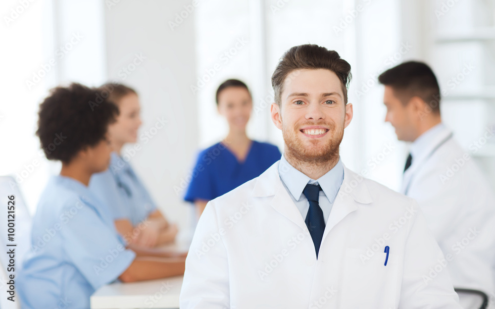 happy doctor over group of medics at hospital happy doctor over group of medics at hospital