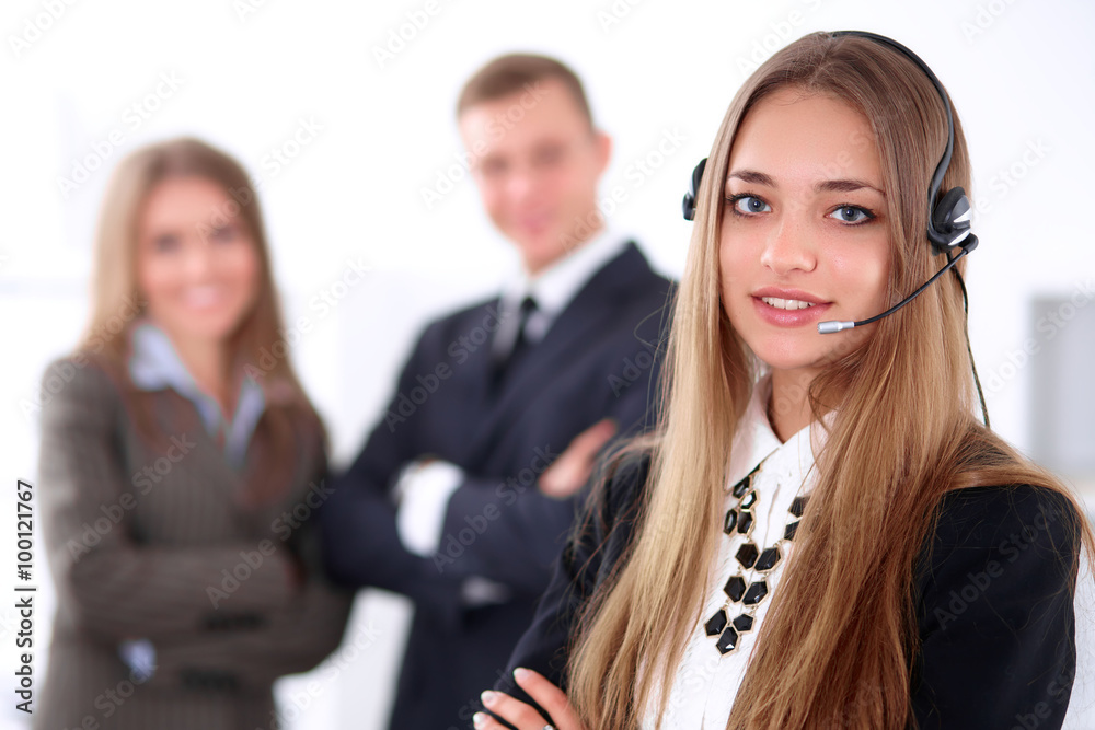Portrait of beautiful cheerful smiling call operator on the background of business people. Successful call center concept Portrait of beautiful cheerful smiling call operator on the background of business people. Successful call center concept