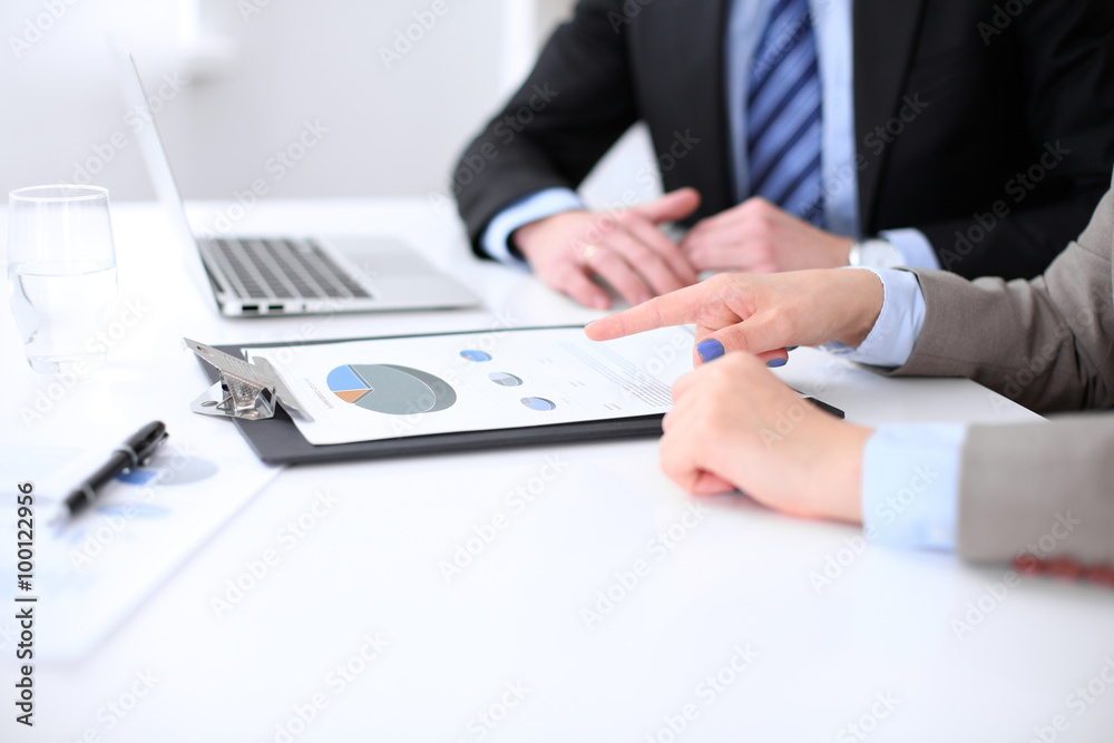 Two successful business partners working at meeting in office Two successful business partners working at meeting in office