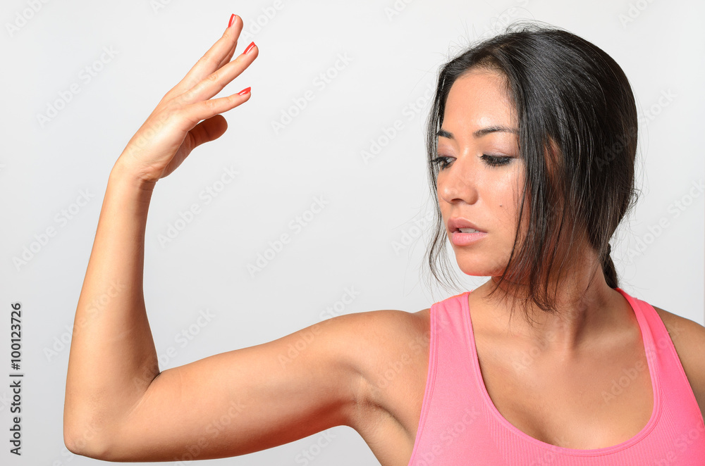 Pretty young woman making a graceful arm gesture Pretty young woman making a graceful arm gesture