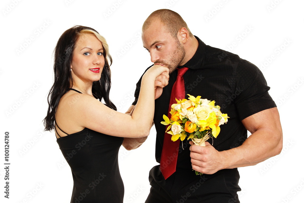 Big muscular man kissing hand of her girlfriend