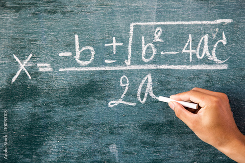 Maths formulas written by white chalk on background,greenboard